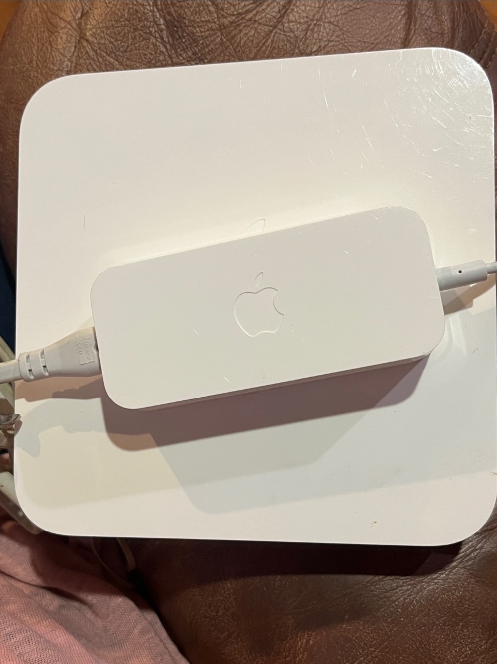 Apple AirPort Extreme base station with power supply.